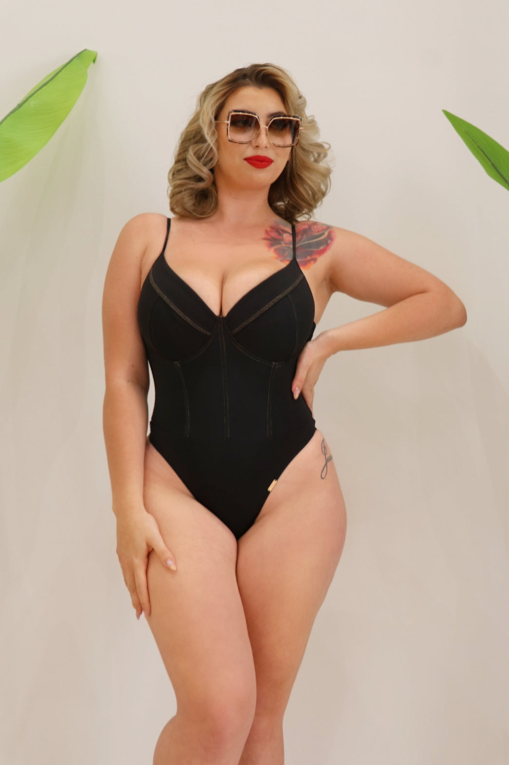 Woman wearing a medium coverage one piece in black