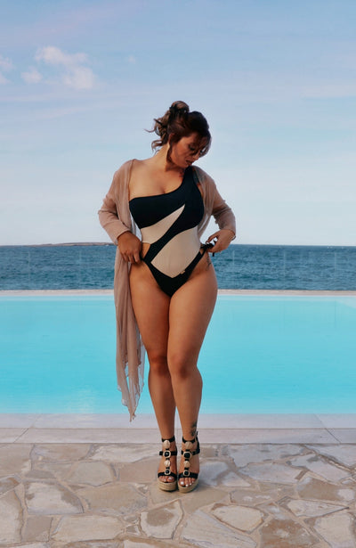 Woman wearing an asymmetrical One Piece Swimsuit